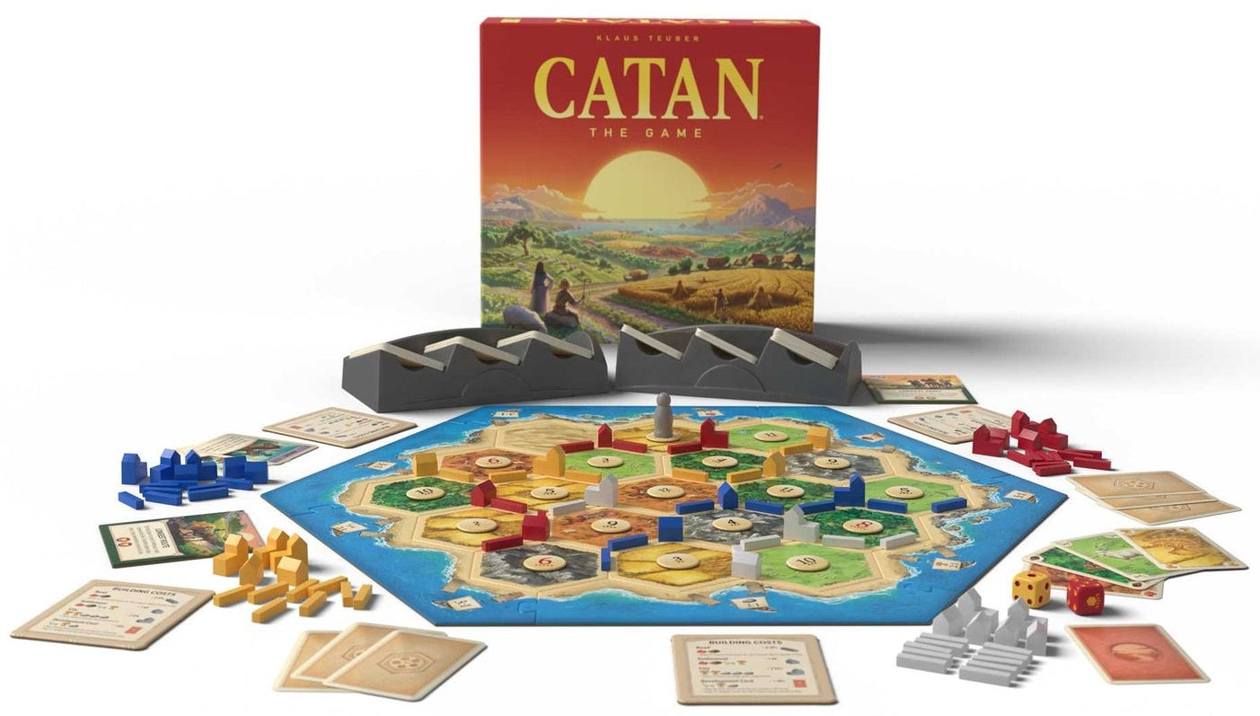 Settlers of Catan board game with components on a white background